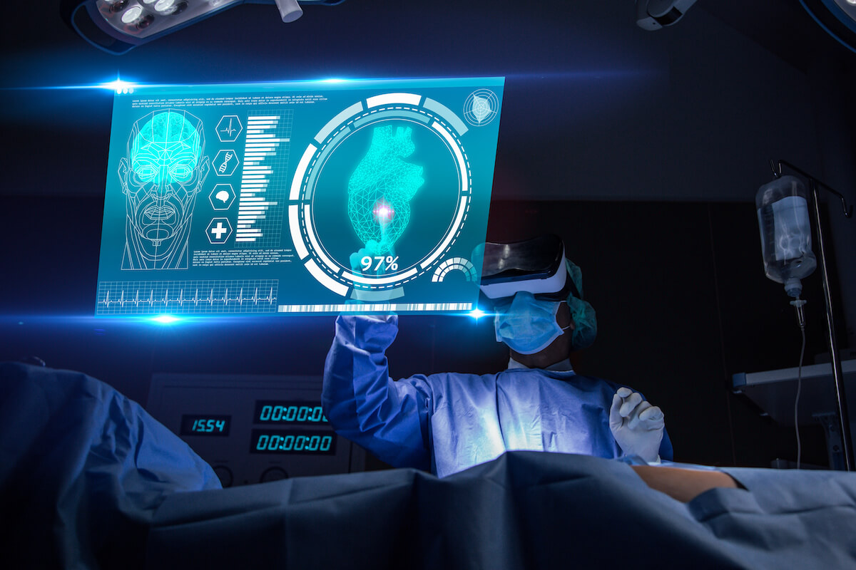 Doctor with virtual reality in operation room in hospital.Surgeon analyzing patient heart testing result and anatomy on technological digital futuristic virtual interface,VR concept.