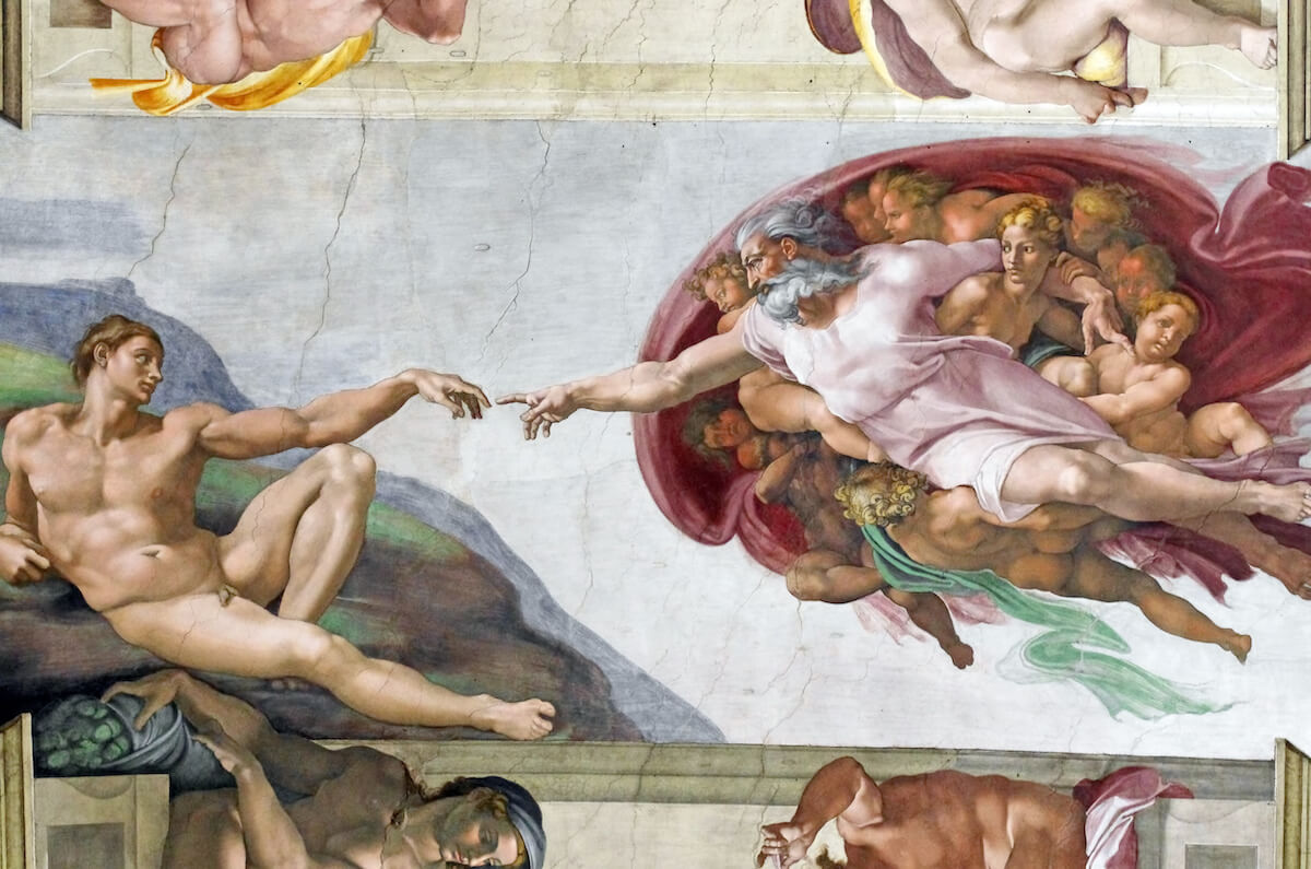 A close-up of The Creation of Adam, one of the fresco paintings by 
Michelangelo that is part of the Sistine Chapel’s ceiling. Photo by Savcoco via stock.adobe.com. 