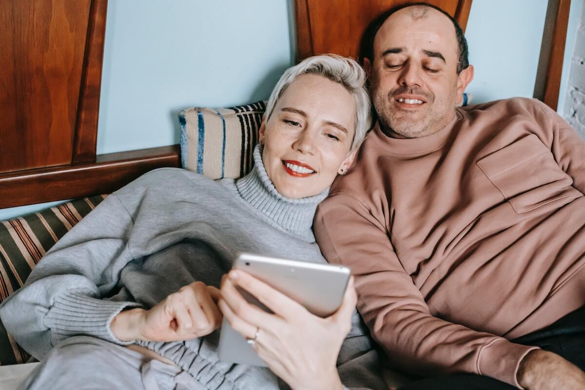 A couple watching on a tablet