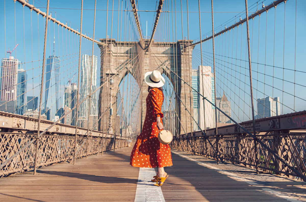 Young tourist on the Brooklyn Bridge in New York City