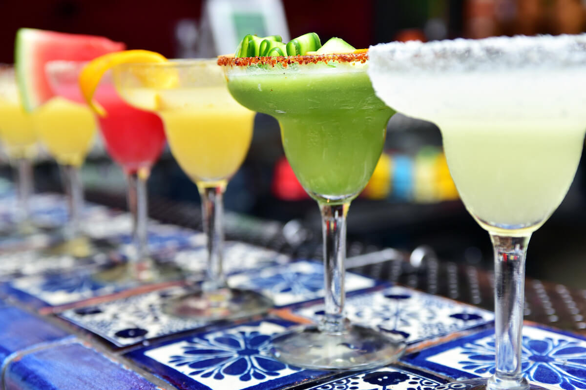 Margarita cocktails with different flavours. Selective focus, main focus on salt with chilli pepper.