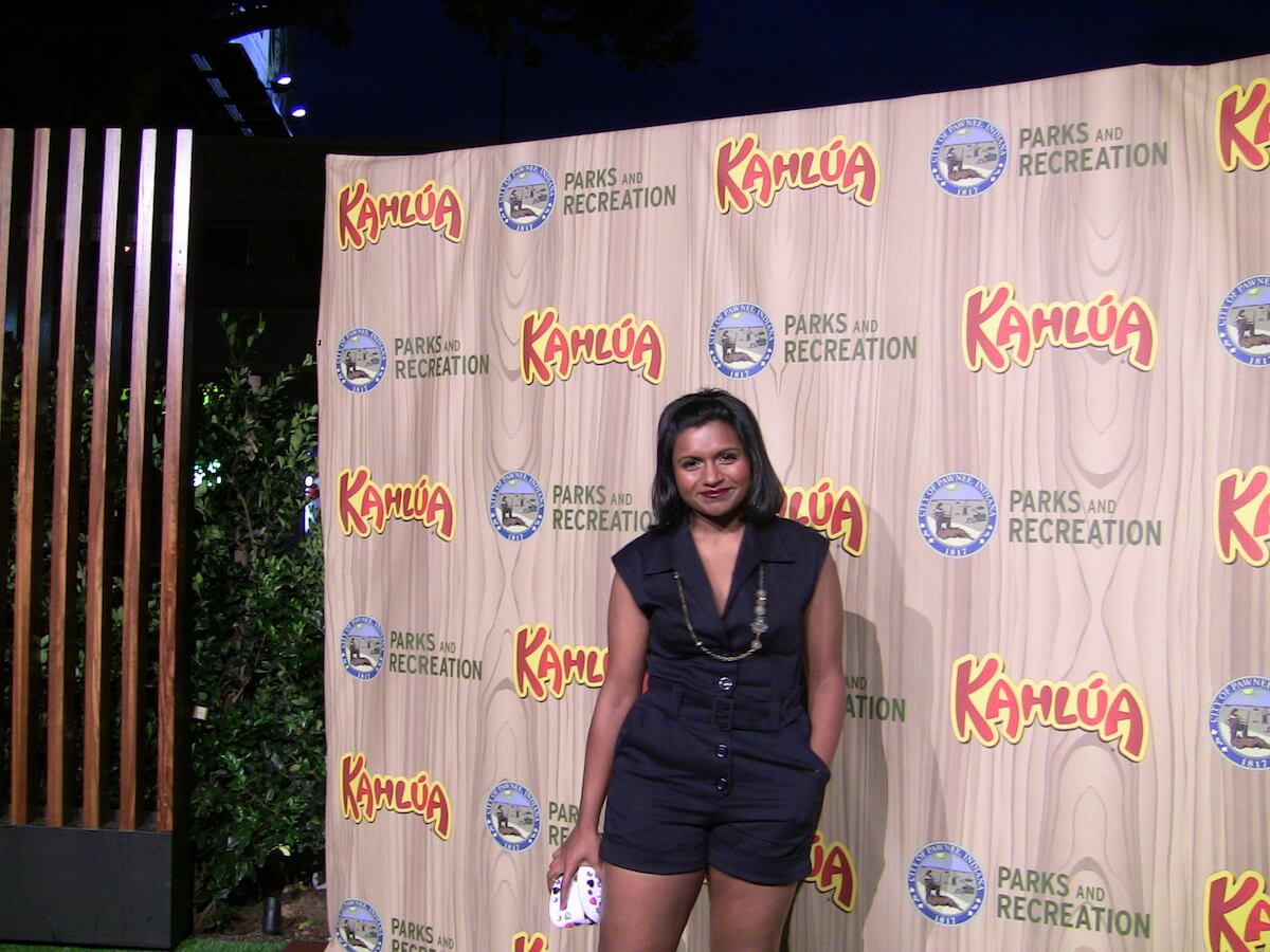 Mindy Kaling at an event posing for camera.
