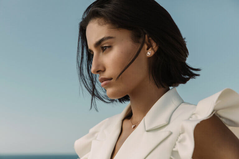 Woman wearing lab-grown diamond earrings by Idyl Jewelry