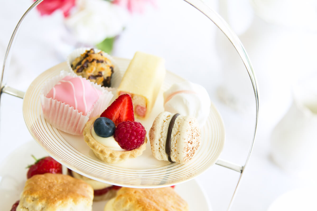 Afternoon tea served with an assortment of cakes