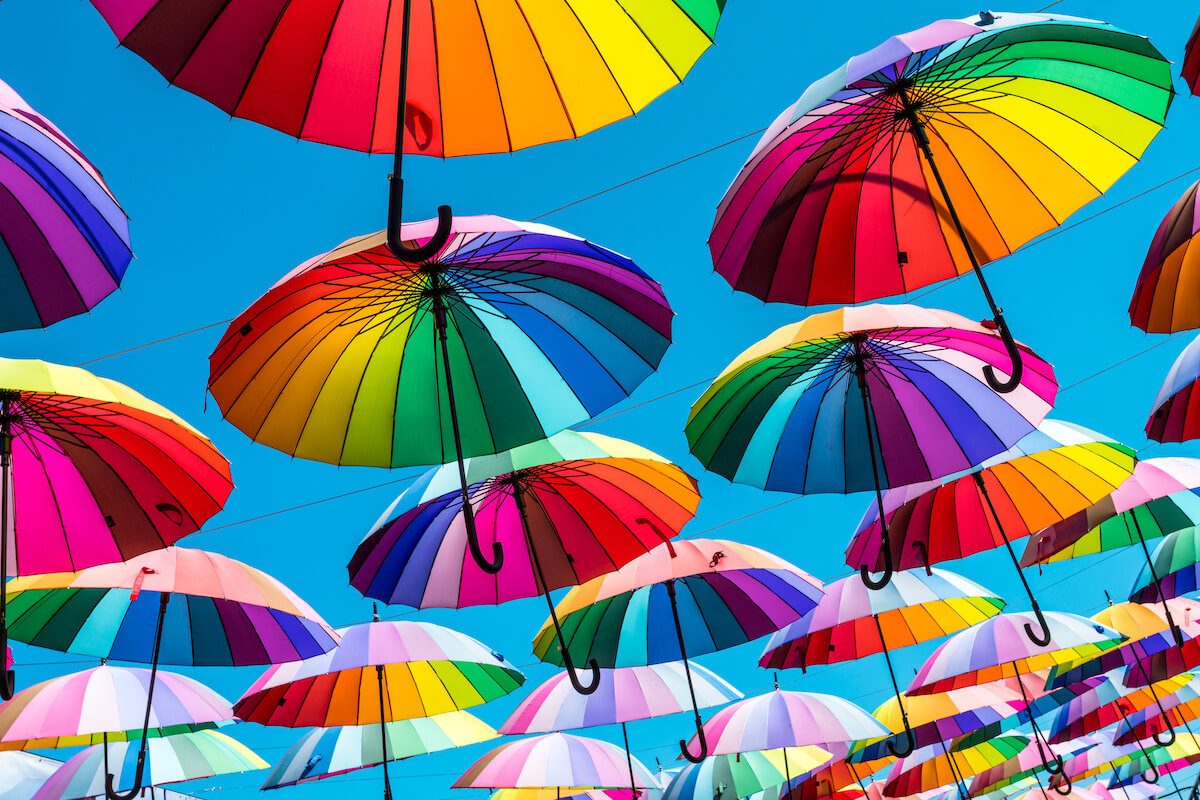 Rainbow umbrella above the street, LGBT symbols.