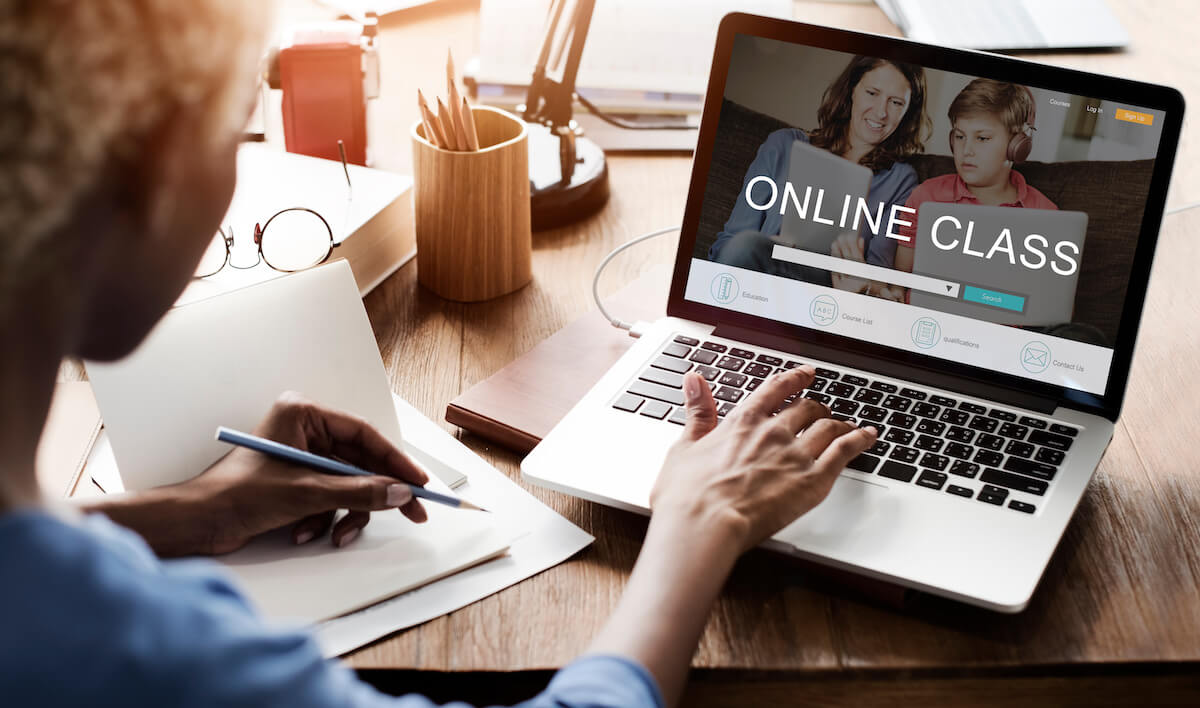 Woman searching for an online class on her computer.