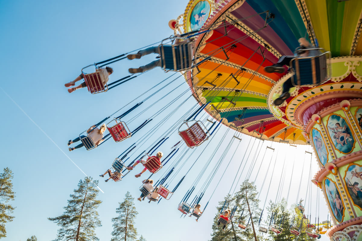 Ride Swing Carousel in motion in amusement park