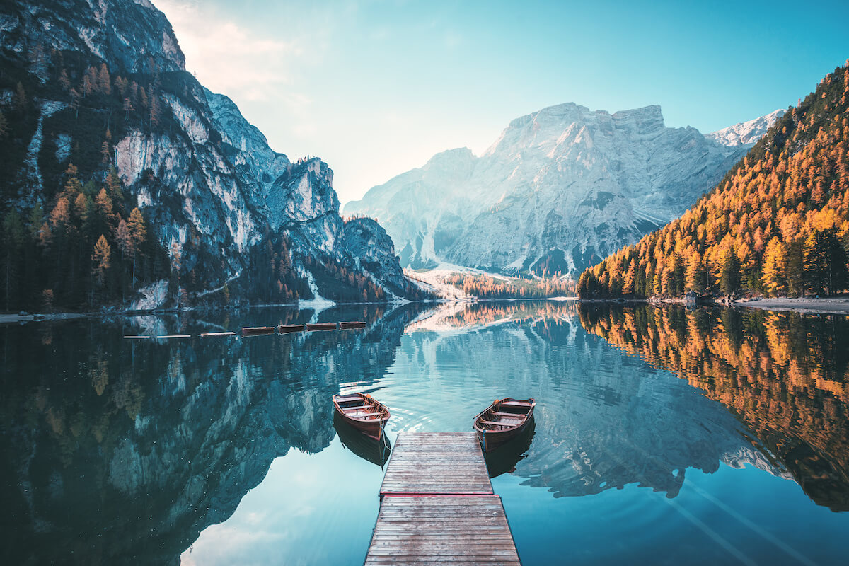 Boats on the Braies Lake ( Pragser Wildsee ) in Dolomites mountains, Sudtirol, Italy