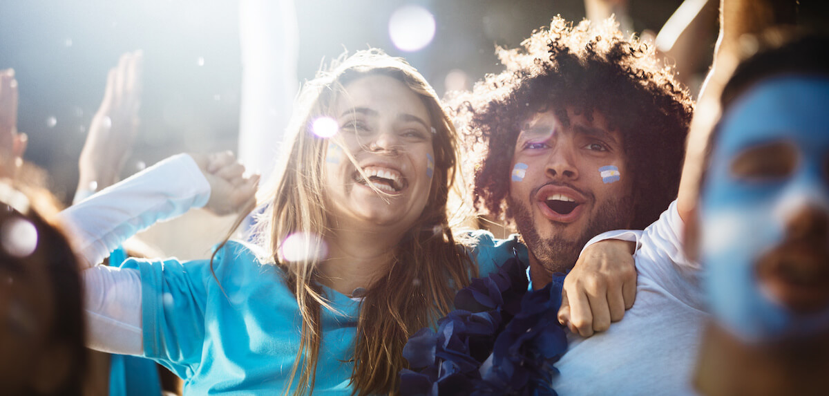 Ecstatic group of people in the stadium during sports event.