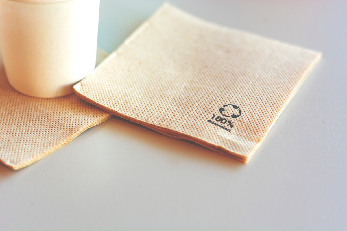 Disposable napkin made from recycled paper.