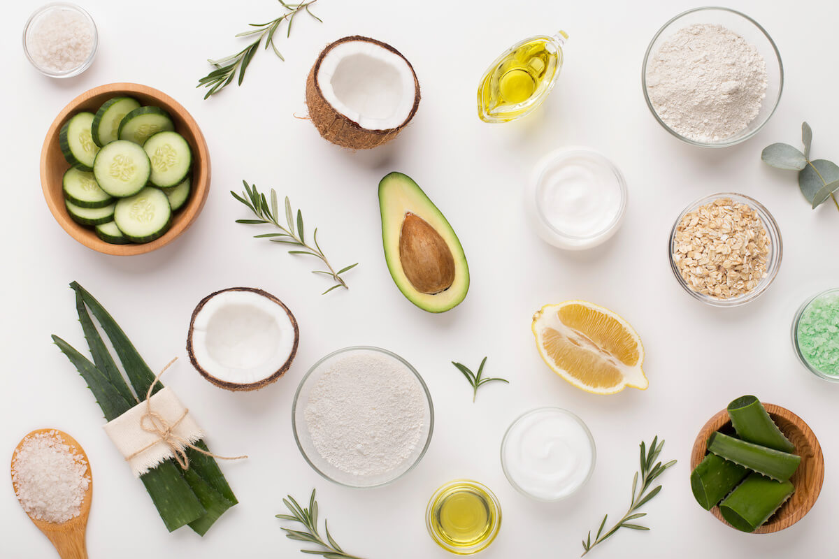 Homemade skin care and body scrub with natural ingredients on white background