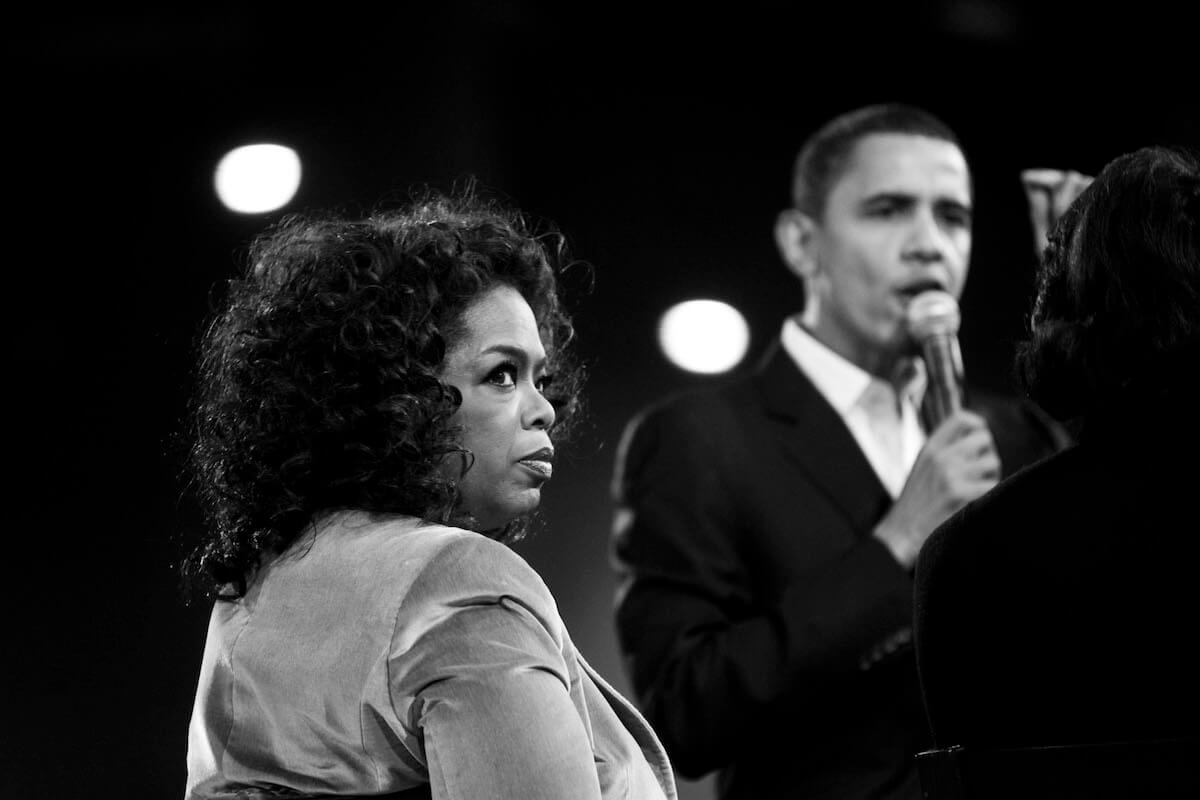 Oprah and Obama speaking at an event