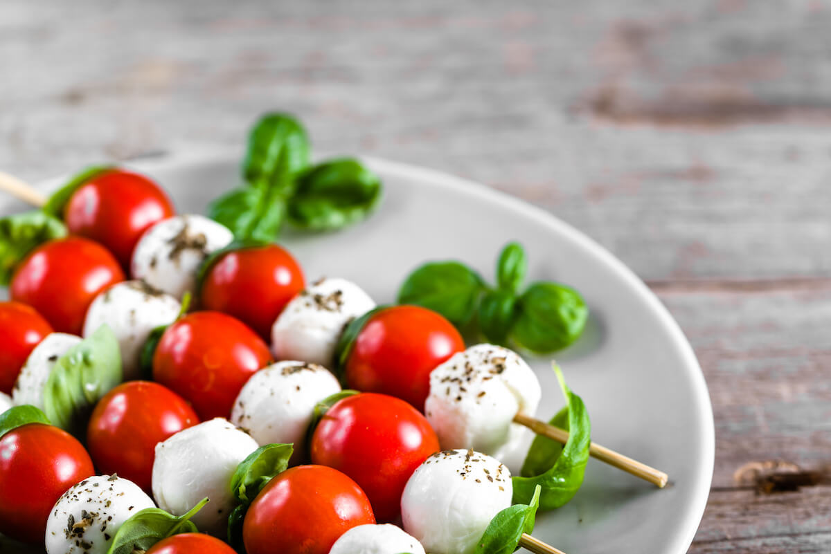 Caprese salad - skewer with tomato, mozzarella and basil, italian food and healthy vegetarian diet 