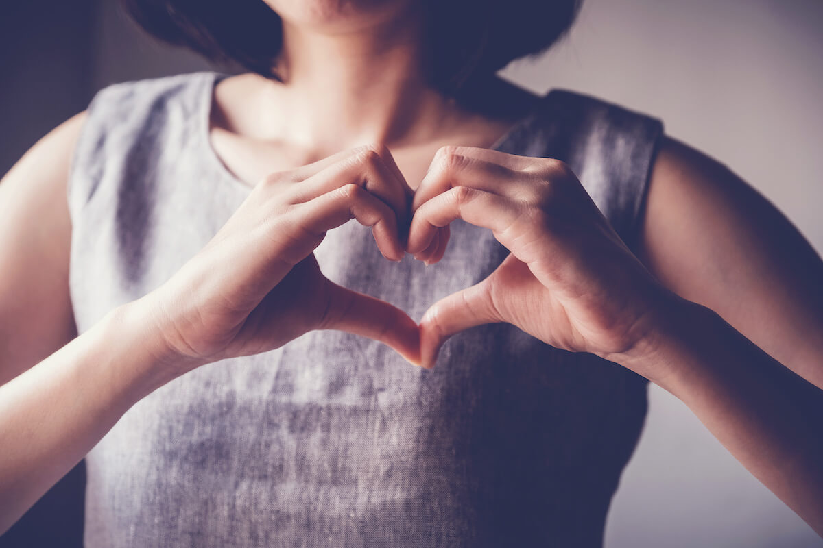 Woman making her hands in heart shape