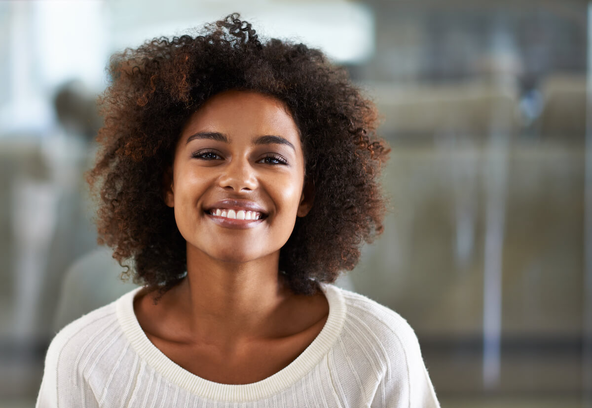 Portrait of a smiling young woman at home.