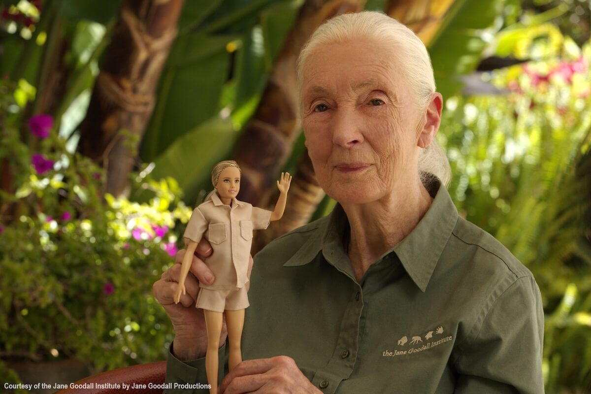 Jane Goodall holding the Barbie modelled after her.