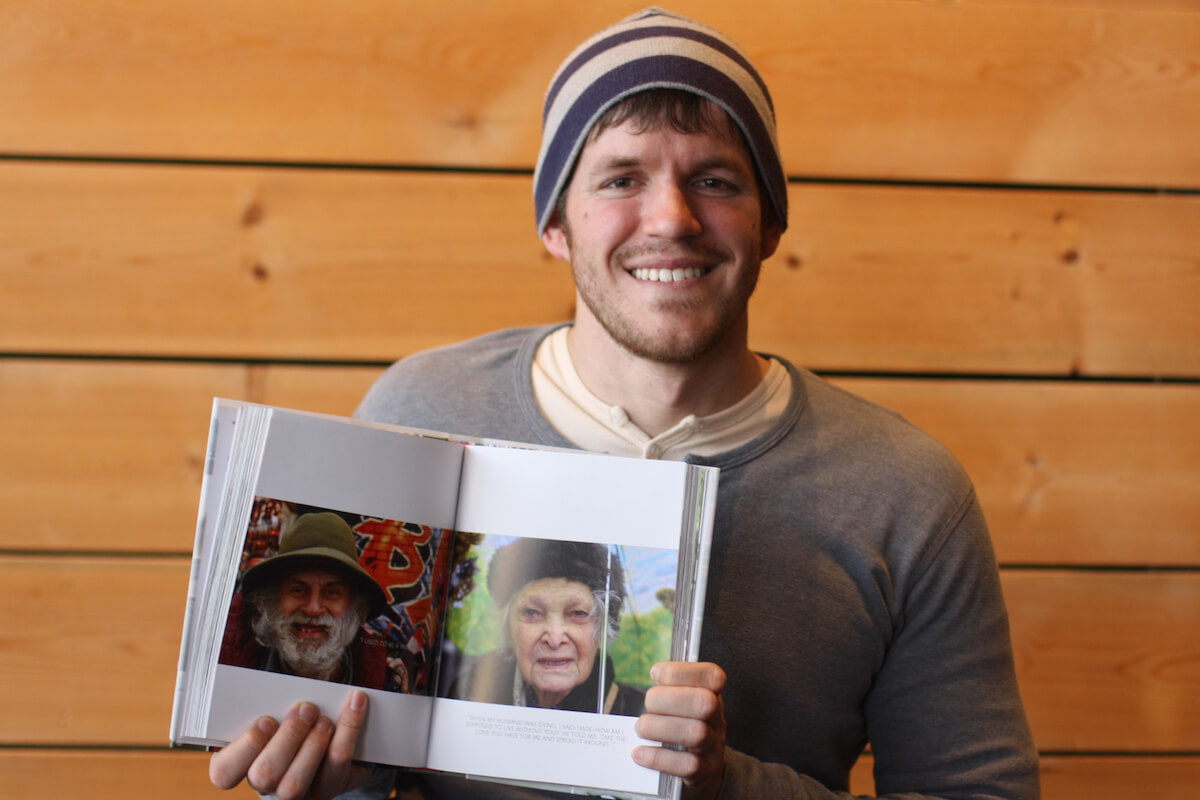 Image of Brandon Stanton holding his book Humans of New York.